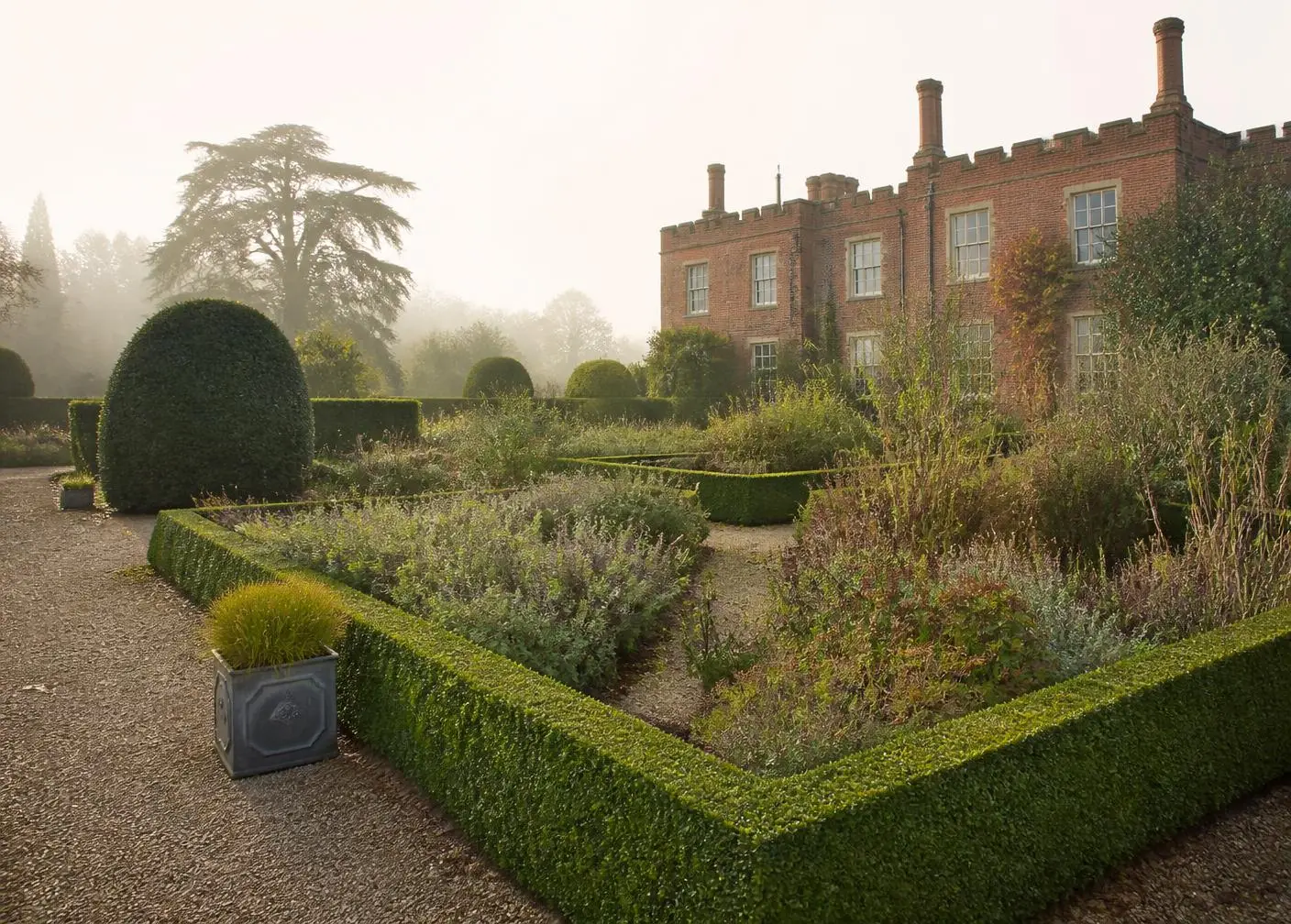 A landscaped garden in Epsom, Surrey, with stone terrace and layered planting